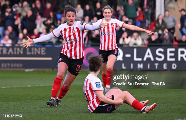 Mary McAteer of Sunderland celebrates scoring her team's third goal with teammate Elizabeta Ejupi of Sunderland and Emily Scarr during the Barclays...