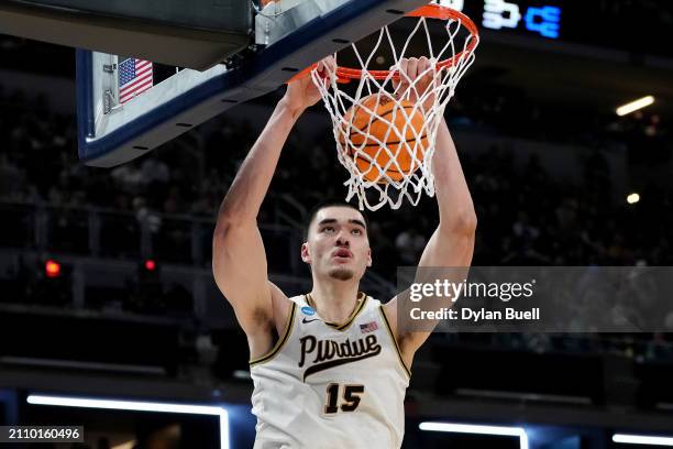 Zach Edey of the Purdue Boilermakers dunks the ball against the Utah State Aggies during the first half in the second round of the NCAA Men's...