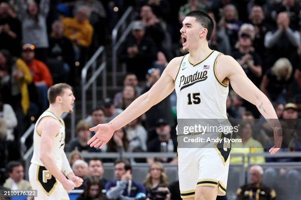 Zach Edey of the Purdue Boilermakers celebrates a basket against the Utah State Aggies during the second half in the second round of the NCAA Men's...