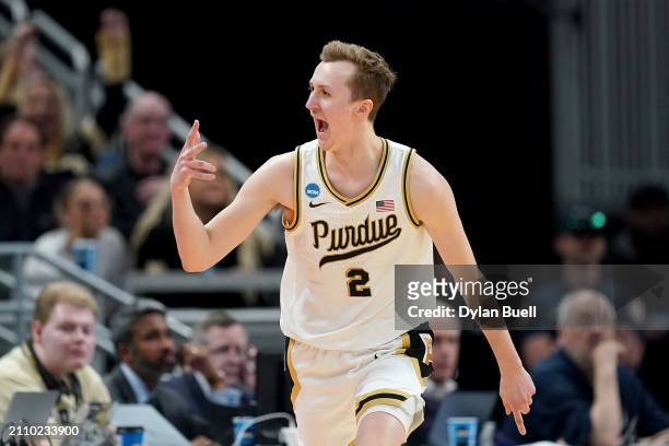 Fletcher Loyer of the Purdue Boilermakers celebrates a three point basket against the Utah State Aggies during the second half in the second round of...