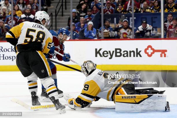 Jonathan Drouin of the Colorado Avalanche scores the winning goal against Kris Letang and goalie Alex Nedeljkovic of the Pittsburgh Penguins during...