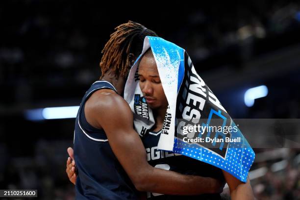 Josh Uduje and Darius Brown II of the Utah State Aggies react against the Purdue Boilermakers during the second half in the second round of the NCAA...