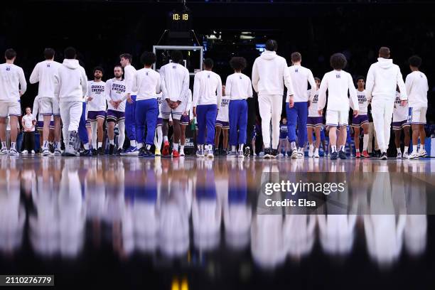 James Madison Dukes and Duke Blue Devils players shake hands prior to their game in the second round of the NCAA Men's Basketball Tournament at...