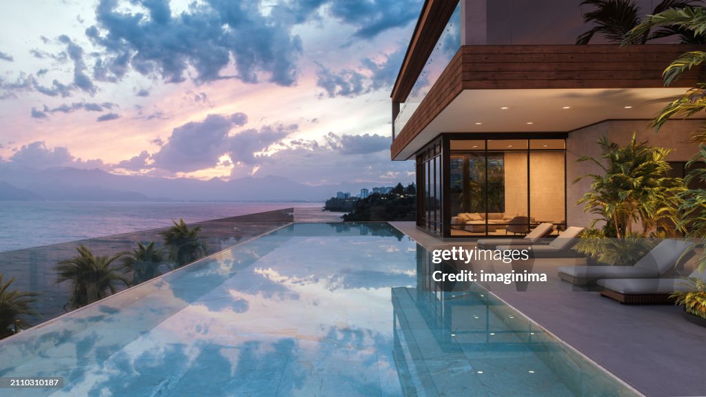 Luxuriöse tropische Poolvilla in der Abenddämmerung