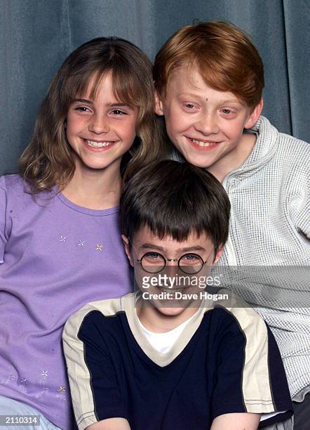 Actors Emma Watson, Rupert Grint and Daniel Radcliffe attend a photocall to present the new cast of the Harry Potter Films, London, August 23, 2000.