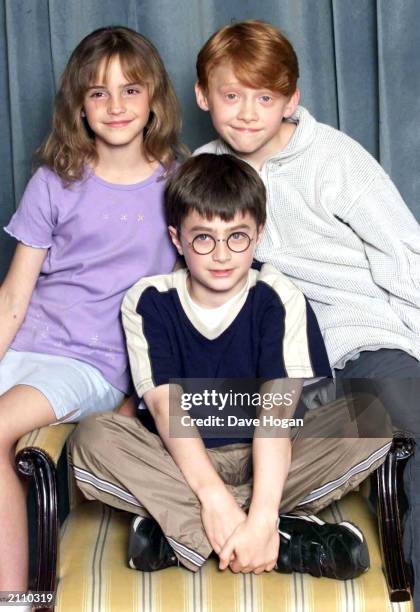 Actors Emma Watson, Rupert Grint and Daniel Radcliffe attend a photocall to present the new cast of the Harry Potter Films, London, August 23, 2000.