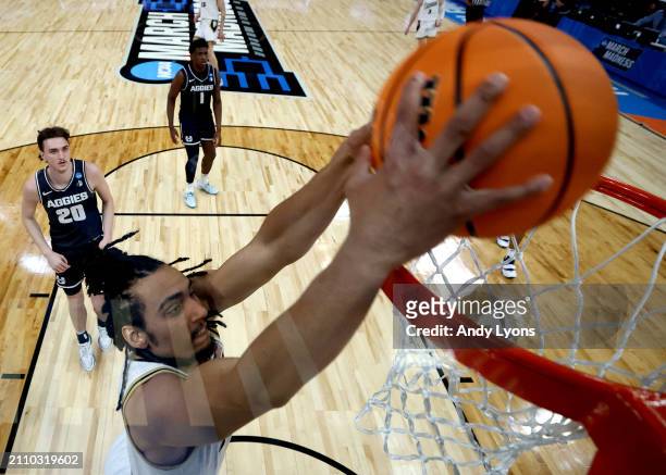 Trey Kaufman-Renn of the Purdue Boilermakers dunks the ball against the Utah State Aggies during the second half in the second round of the NCAA...