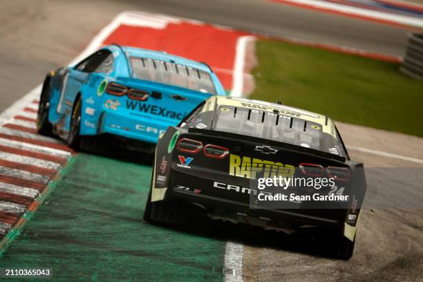 William Byron, driver of the RaptorTough.com Chevrolet, and Ross Chastain, driver of the Worldwide Express Chevrolet, race during the NASCAR Cup...