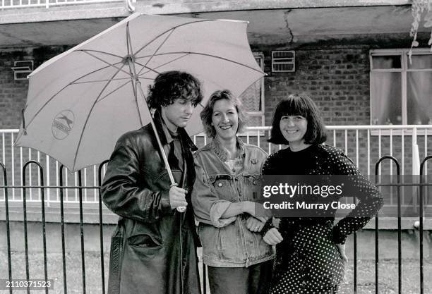 Actors Paul McGann Hairdresser, Sue Love and Costume Designer, Andrea Galer on the set of the 1987 film, 'Withnail and I,' London, UK, 1986. {Photo...