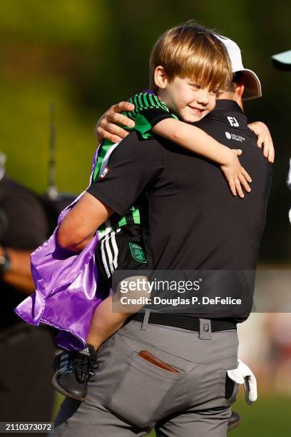 Peter Malnati of the United States holds his son on the on the 18th green after the final round of the Valspar Championship at Copperhead Course at...