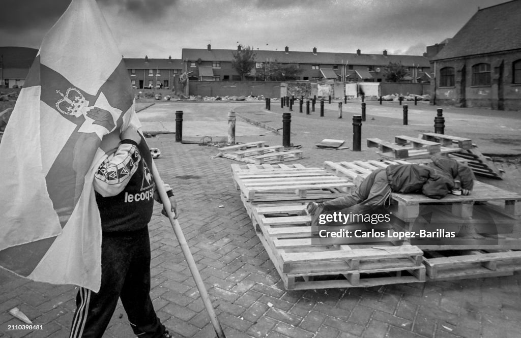 Young loyalist supporters gather wood in Sandy Row East Belfast