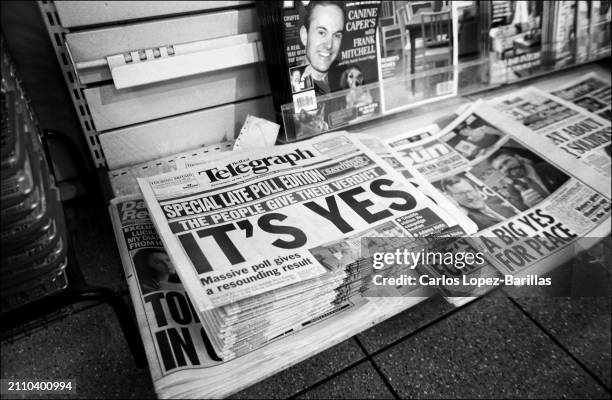 Local and national newspapers display the results of the Good Friday Agreement Referendum at a newsagent in Belfast, Northern Ireland, UK. 24th May...