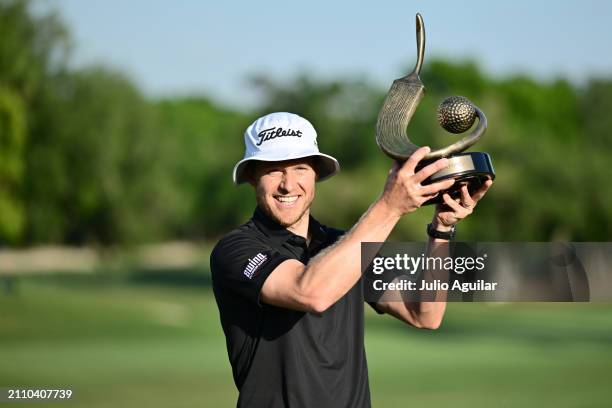 Peter Malnati of the United States accepts the Valspar Championship Trophy after the final round of the Valspar Championship at Copperhead Course at...