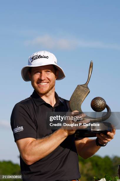Peter Malnati of the United States accepts the Valspar Championship Trophy after the final round of the Valspar Championship at Copperhead Course at...