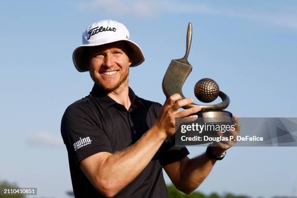 Peter Malnati of the United States accepts the Valspar Championship Trophy after the final round of the Valspar Championship at Copperhead Course at...