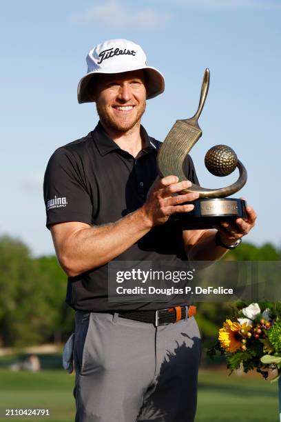 Peter Malnati of the United States poses with the Valspar Championship Trophy after the final round of the Valspar Championship at Copperhead Course...