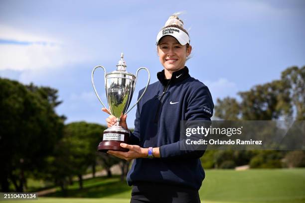 Nelly Korda of the United States celebrates with the trophy after winning the FIR HILLS SERI PAK Championship at Palos Verdes Golf Club on March 24,...