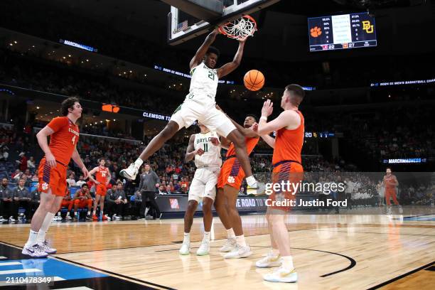 Yves Missi of the Baylor Bears dunks the ball against the Clemson Tigers during the first half in the second round of the NCAA Men's Basketball...