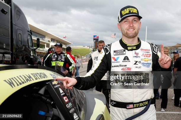 William Byron, driver of the RaptorTough.com Chevrolet, poses with the winner sticker on his car after winning the NASCAR Cup Series EchoPark...