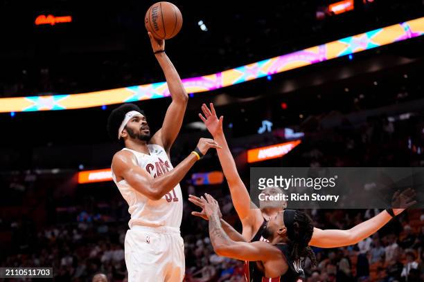 Jarrett Allen of the Cleveland Cavaliers goes up for a shot against Nikola Jovic of the Miami Heat during the first quarter at Kaseya Center on March...