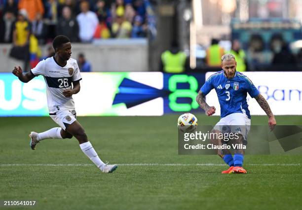 Federico Dimarco of Italy competes for the ball with Alan Minda of Ecuador during the International Friendly match between Ecuador and Italy at Red...