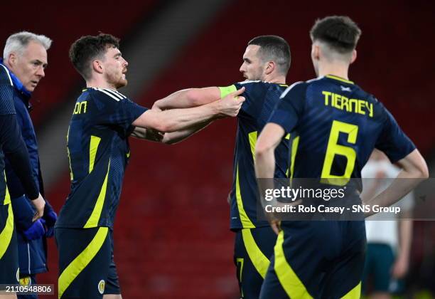 Scotland's Andy Robertson gives the captains armband to John McGinn after he is forced off injured during an International Friendly match between...