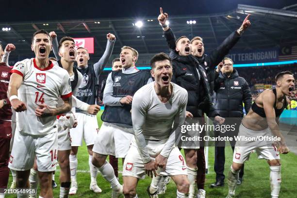 Poland celebrate their victory during the UEFA EURO 2024 Play-Offs semifinal match between Wales and Poland at Cardiff City Stadium on March 26, 2024...