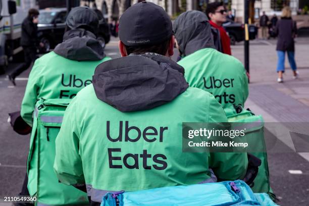 Uber Eats takeaway delivery cycle couriers on 5th March 2024 in London, United Kingdom. Uber Eats is an online food ordering and delivery platform...