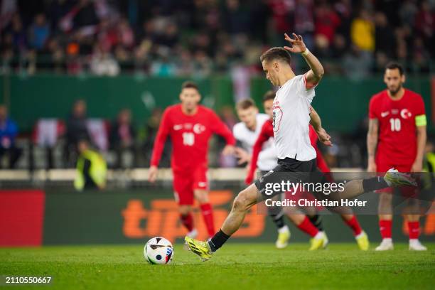 Christoph Baumgartner of Austria scores his team's fifth goal from the penalty-spot during the international friendly match between Austria and...