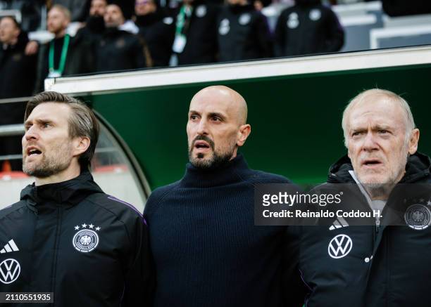 Coach Antonio Di Salvo and assistant coaches Daniel Niedzkowski and Hermann Gerland are seen prior to the UEFA Under21 EURO Qualifier Germany U21 v...
