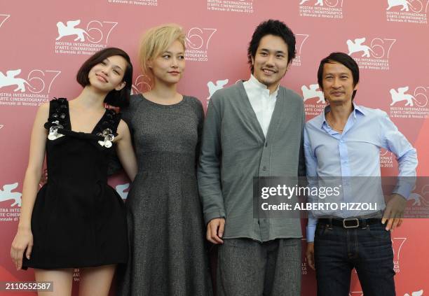 Japanese actresses Kiko Mizuhara, Rinko Kikuchi, Japanese actor Kenichi Matsuyama and French film director Tran Anh Hung pose during the photocall of...