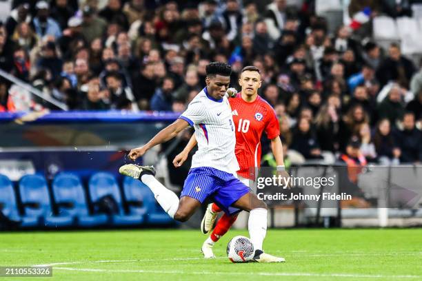 Aurelien TCHOUAMENI of France and Alexis SANCHEZ of Chile during the friendly match between France and Chile at Orange Velodrome on March 26, 2024 in...