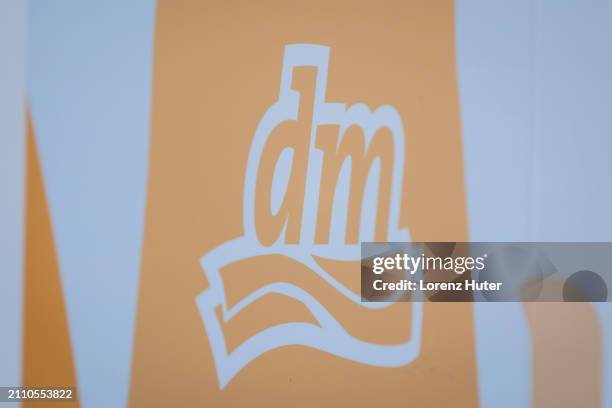 In this photo illustration of the logo of German drug-store chain DM, on March 27, 2024 in Berlin, Germany.