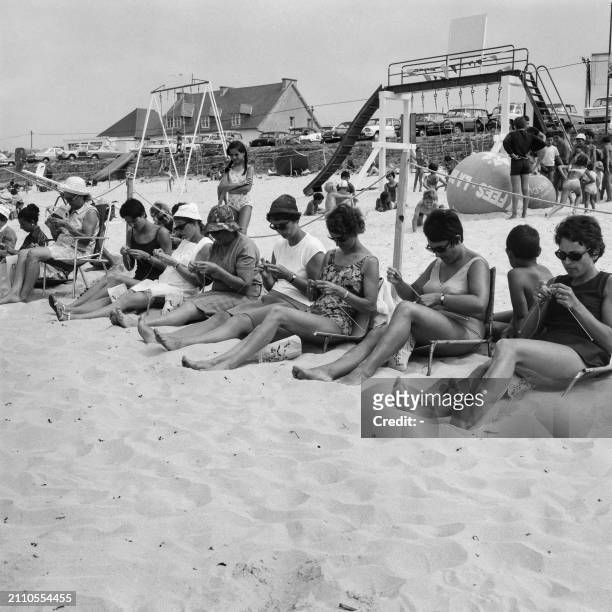 Women participate in a knitting competition on July 29, 1969 on the beach of Trestel, in the Côtes d'Armor in Brittany.
