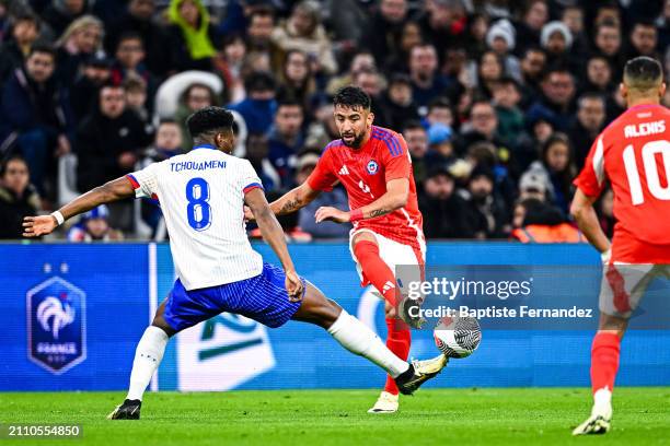 Aurelien TCHOUAMENI of France and Mauricio ISLA of Chile during the friendly match between France and Chile at Orange Velodrome on March 26, 2024 in...