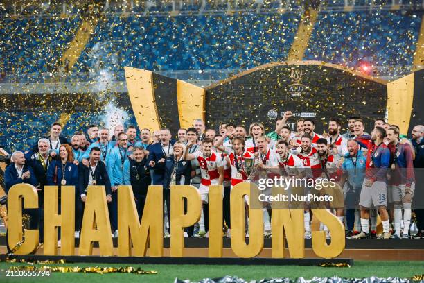 Players from Croatia are raising the trophy after winning the friendly football match between Egypt and Croatia at Misr Stadium in the New...