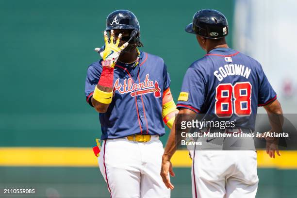 Ronald Acuña Jr. #13 of the Atlanta Braves celebrates after hitting an RBI single in the fifth inning during a Grapefruit League spring training game...