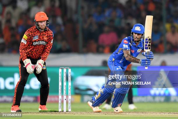 Mumbai Indians' Tilak Varma plays a shot as Sunrisers Hyderabad's wicketkeeper Heinrich Klaasen fields during the Indian Premier League Twenty20...