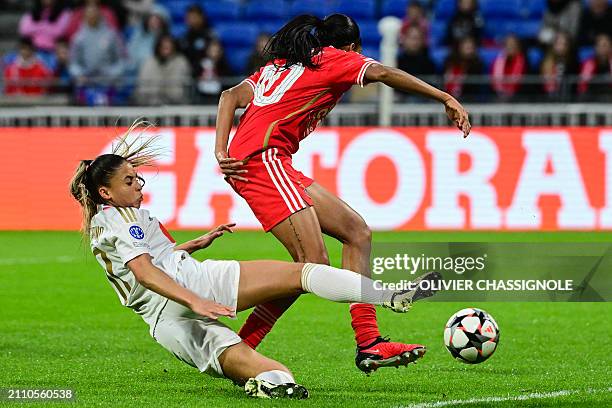 Lyon's French forward Delphine Cascarino fights for the ball with Benfica's Brazilian midfielder Lais Araujo during the UEFA Women's Champions League...