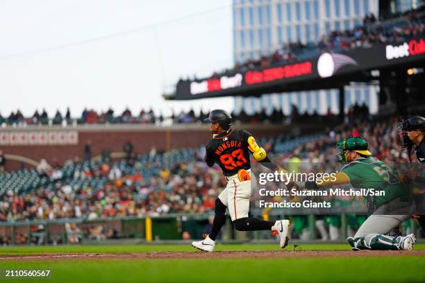 Ismael Munguia Swings at a pitch at Oracle Park on March 26, 2024 in San Francisco, California.