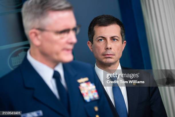 Secretary of Transportation Pete Buttigieg, right, and Vice Admiral Peter W. Gautier, Coast Guard Deputy Commandant for Operations, field questions...