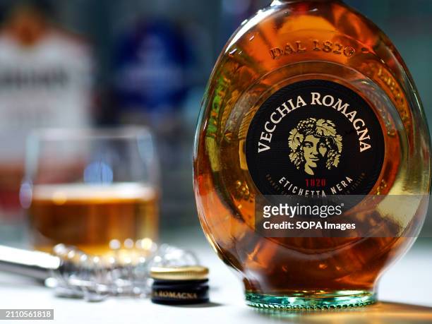 In this photo illustration, a bottle of Vecchia Romagna Etichetta Nera brandy seen displayed on a table.