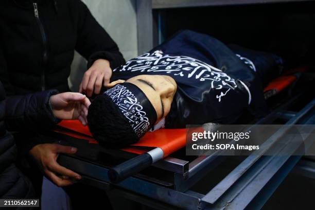 Relatives mourn near a body of one of the 3 Palestinians who were killed by Israeli forces' bullets during a raid on the Damj neighborhood in Jenin...