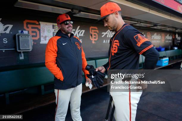 Ryan Christenson and Michael Conforto of the San Francisco Giants prepare for the Giants game at Oracle Park on March 26, 2024 in San Francisco,...