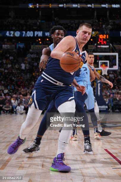Nikola Jokic of the Denver Nuggets dribbles the ball during the game against the Memphis Grizzlies on March 25, 2024 at the Ball Arena in Denver,...