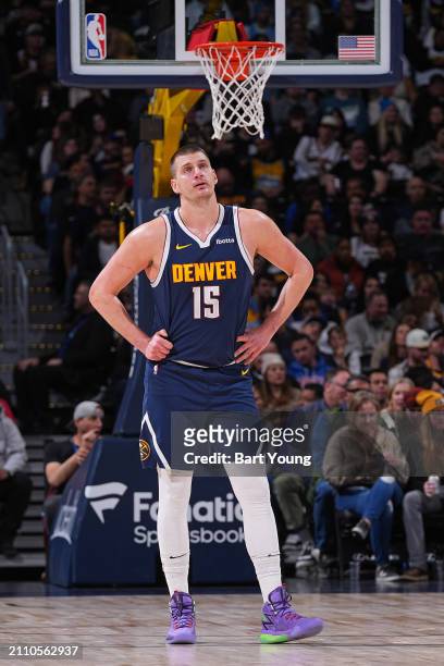 Nikola Jokic of the Denver Nuggets looks on during the game against the Memphis Grizzlies on March 25, 2024 at the Ball Arena in Denver, Colorado....