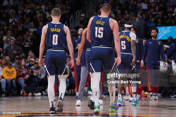 Nikola Jokic and Christian Braun of the Denver Nuggets looks on during the game against the Memphis Grizzlies on March 25, 2024 at the Ball Arena in...