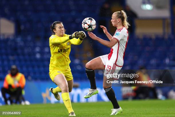 Chelsea goalkeeper Zecira Musovic punches the ball away from Tiny Hoekstra of Ajax during the UEFA Women's Champions League 2023/24 Quarter Final Leg...