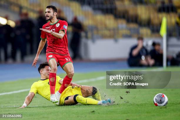 Ali Sulaiman Al Busaidi of Oman and Darren Lok of Malaysia in action during the 2026 World Cup/2027 Asian Cup Qualifiers Group D match between...