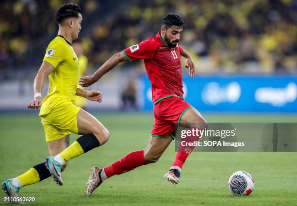 Muhsen Saleh Al Ghassani of Oman and Dominic Tan of Malaysia in action during the 2026 World Cup/2027 Asian Cup Qualifiers Group D match between...